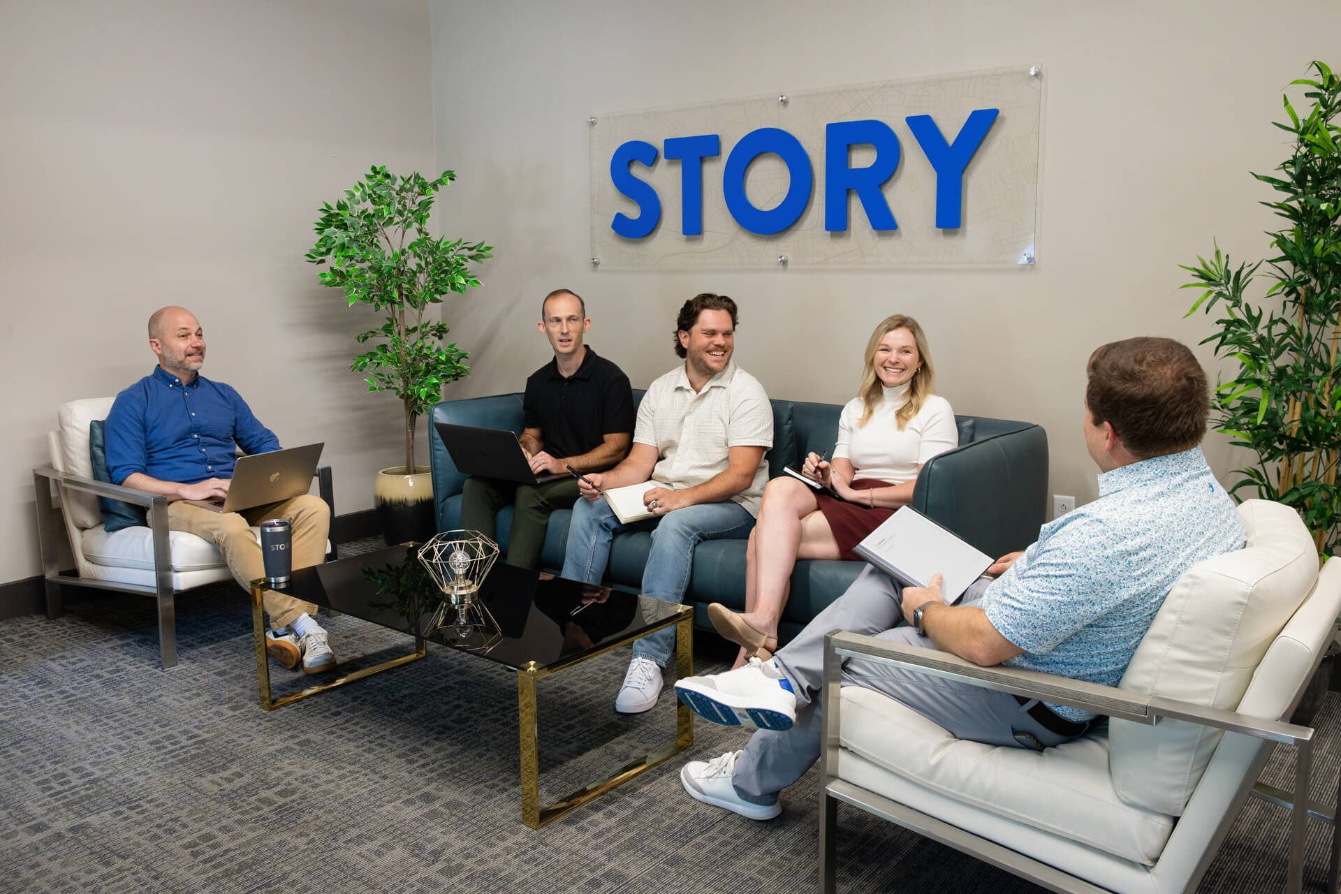 The Story team sitting together in a meeting